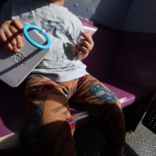 Child Playing with Mirror Toy in Fantasyland