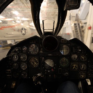 Fighter Jet Cockpit View with Vintage Aircraft Display