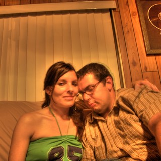 Couple Relaxing Together on Couch in Warm Light