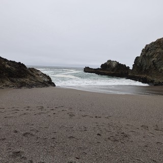 Secluded Cove Between Rocky Cliffs at Dusk