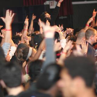 Urban Concertgoers Raise Their Hands in the Air