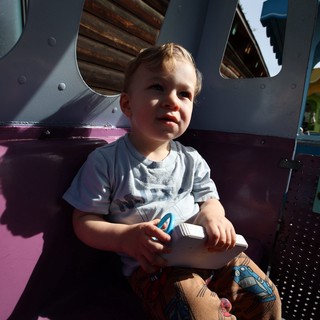 Young Child Enjoying Playground Adventure in Fantasyland