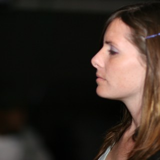 Woman in Profile Gazing into Darkness