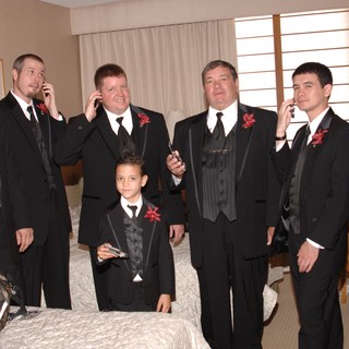 Groomsmen All on Cell Phones Before Wedding