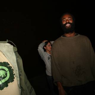 Two Bearded Men and a Woman in Matching T-Shirts