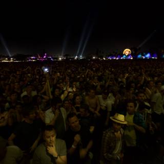 Night sky lit up by concert crowd