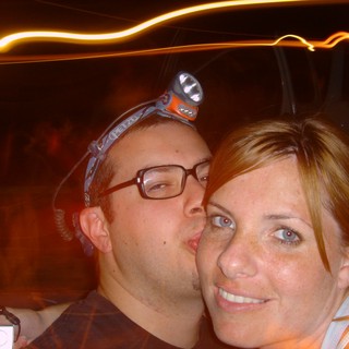 Couple Shares a Kiss at Night Outdoor Event