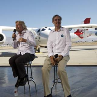Aviation Legends Burt Rutan and Richard Branson in Front of Airplane