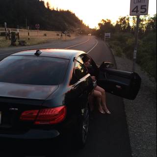 Sunset Sits with Theresa Andersson on the Hood of Her Sports Car