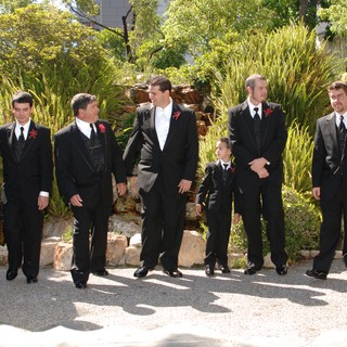 Groomsmen Gather in Garden Before Wedding Ceremony
