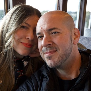 Couple's Romantic Train Journey Through Scenic Landscape