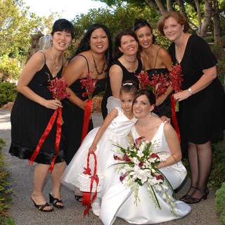 Bride and Bridesmaids Celebrate in Garden Setting