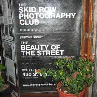 The Skid Row Photography Club Sign