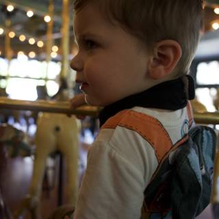 Whimsical Ride: A Child's Moment on the Carousel