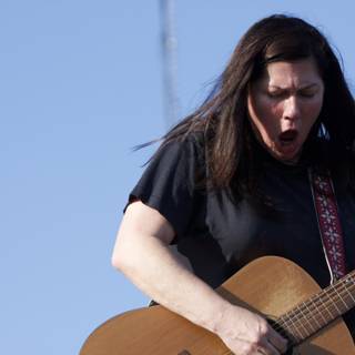 Kim Deal strums her guitar at Coachella 2008