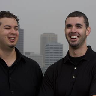 Two Happy Men in Black Shirts