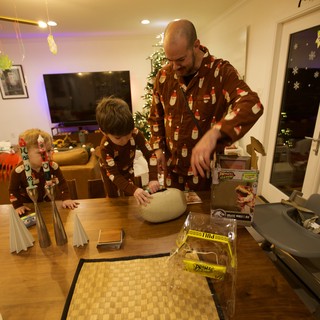Father and Sons Building Christmas Dinosaur Models Together