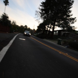 Blurred Evening Road Through Residential Neighborhood