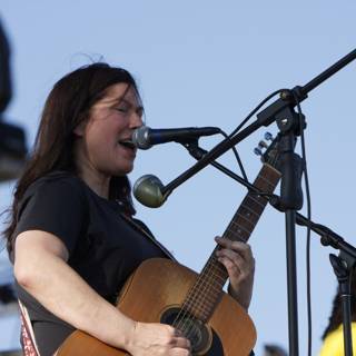 Kim Deal Rocks Coachella with Acoustic Guitar and Microphone