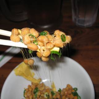 Chopsticks Holding Delicious Food