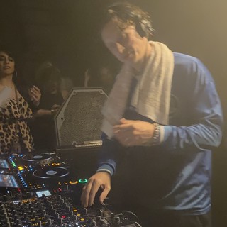DJ Performance in Atmospheric Club Setting