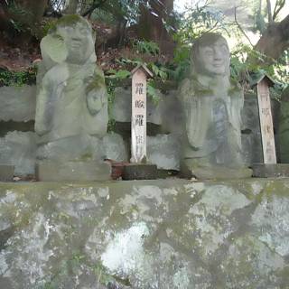Row of numbered stone statues