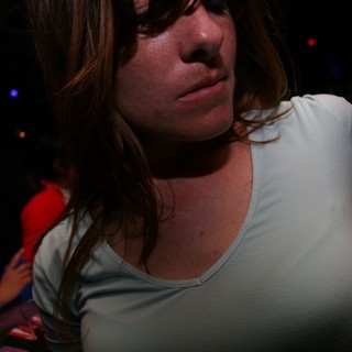 Woman at Nightclub in Dramatic Ambient Light