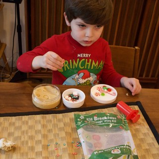Child Playing with Elf Breakfast Play Dough Kit
