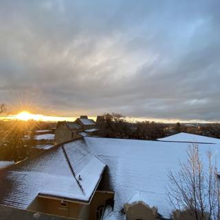 Sunset over Snowy Roof
