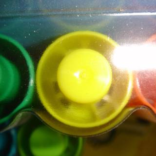 Colorful Buttons in Plastic Container