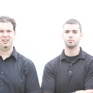 Two Men in Black Shirts