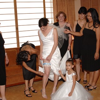 Bride Getting Garter Placed Before Wedding Ceremony