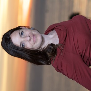 Woman in Red at Golden Hour Seaside