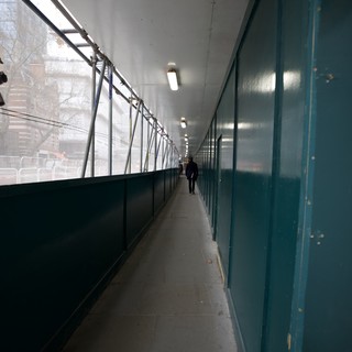 Solitary Figure in Urban Pedestrian Tunnel