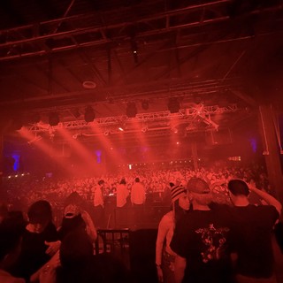 Red Light Illuminates Massive Electronic Music Concert Crowd