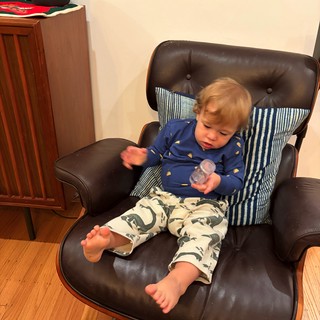 Toddler Relaxing in Mid-Century Modern Lounge Chair