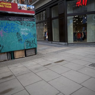 Urban Streetscape with Graffiti Kiosk and H&M Store