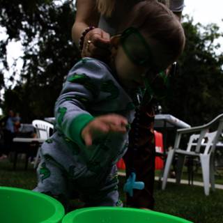 A Joyful Moment: Fun with a Green Bucket
