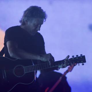 Roger Waters Rocks the Stage with Acoustic Guitar