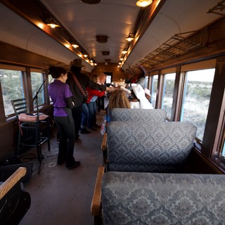 Scenic Train Journey Through Desert Landscape at Dusk