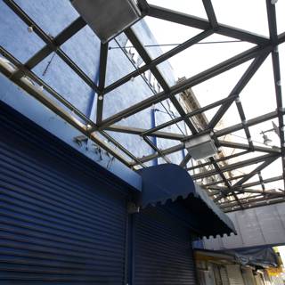 Blue Building with Metal Roof and Sign