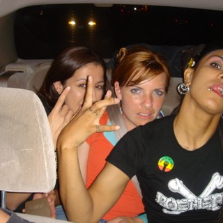 Three Friends Laughing in a Vehicle at Night