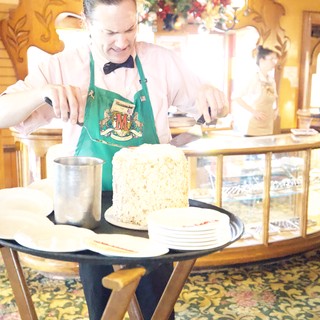 Server Preparing Dessert Tableside at Holiday Restaurant