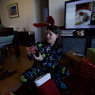 Penelope Opens Christmas Stocking in Skull Onesie