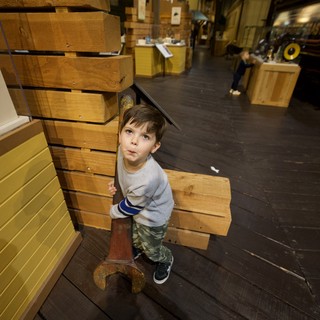 Young Boy Explores Interactive Maritime History Museum