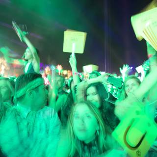 Guy Fieri Rocks the Crowd Caption: Celebrity chef Guy Fieri joins the fun as a boisterous crowd lights up the night with signs and enthusiasm at Coachella 2016.