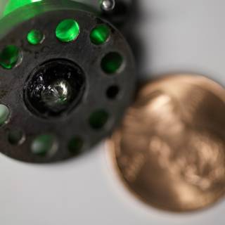 Close Up of Coin and Fly Reel