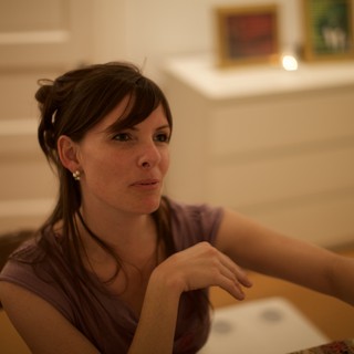 Thoughtful Woman at Art Gallery Evening Event