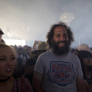 Bearded Man and Smiling Woman in Coachella Crowd