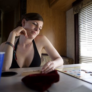 Contemplative Woman Playing Scrabble in RV